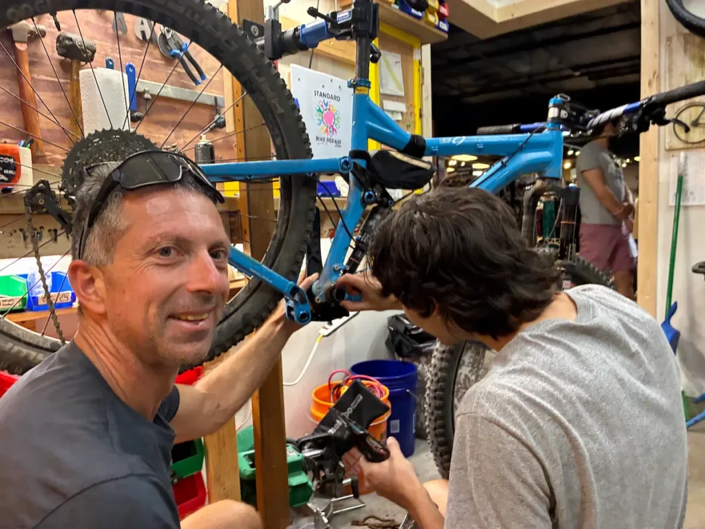 Mechanic helping a customer at Standard Bike Repair in Boulder