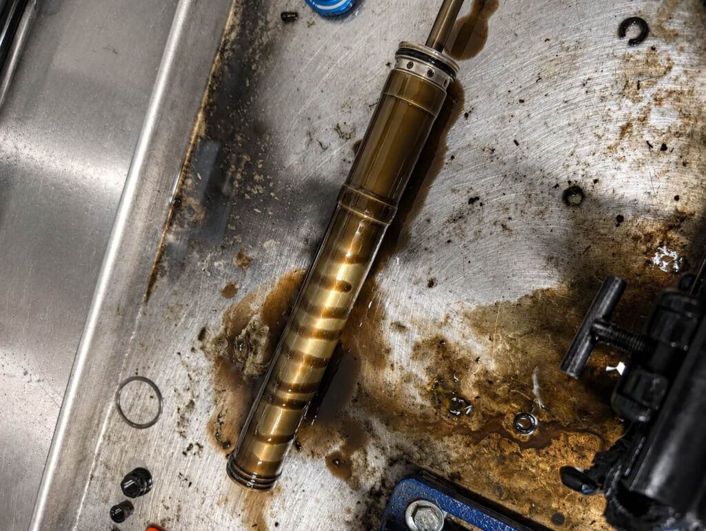 Suspension damper shaft removed during service