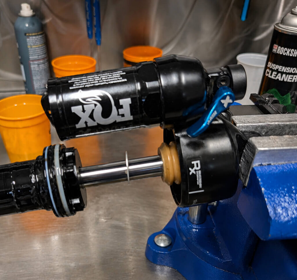 Fox rear shock disassembled for suspension service